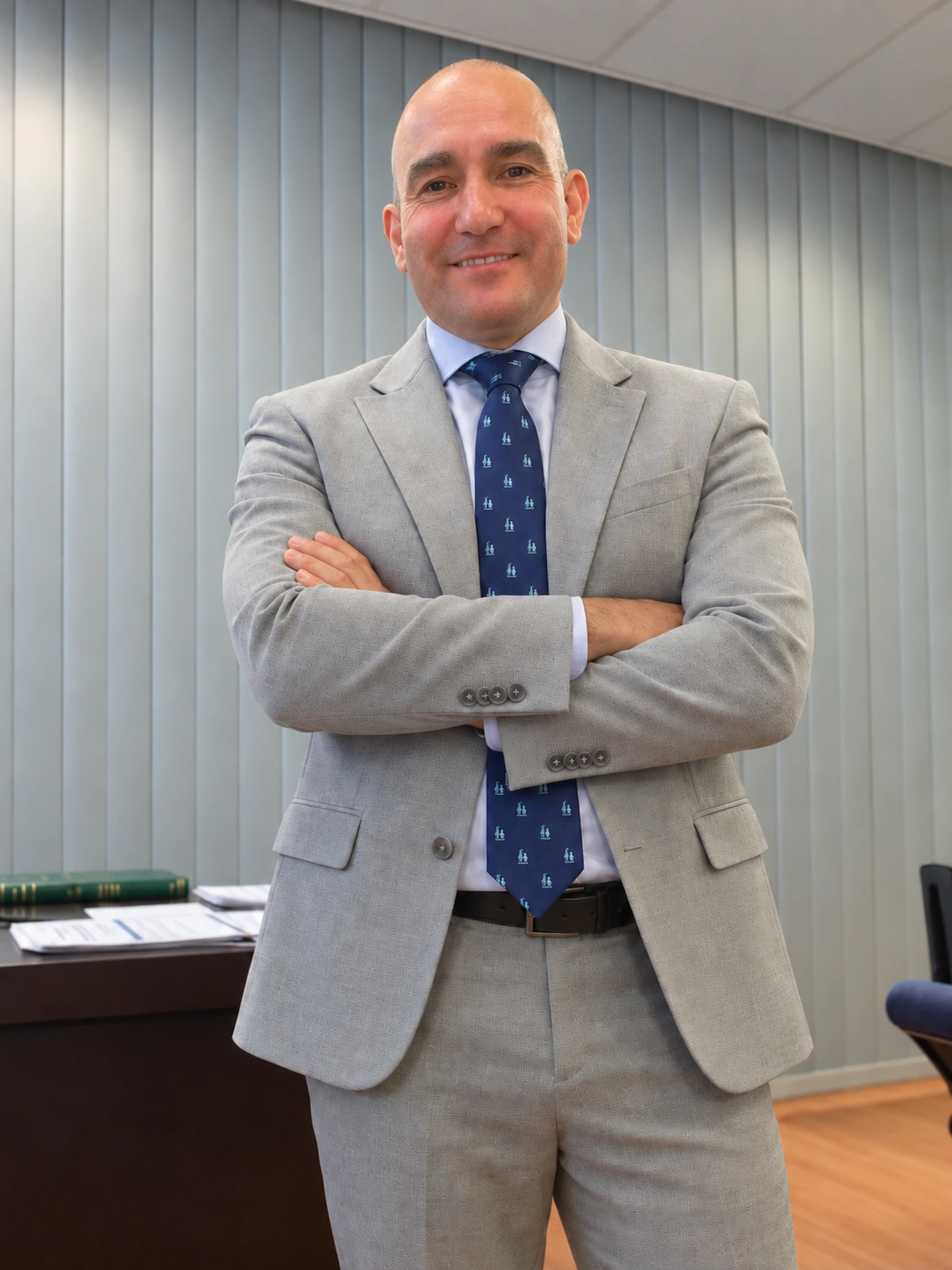 Dr. Ignacio S. Gatell in a grey suit with arms crossed